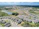 Aerial view of a residential community near a pond at 828 Scrub Oak Hammock Rd, Davenport, FL 33837