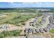 Aerial view showcasing a neighborhood with houses and a pond at 828 Scrub Oak Hammock Rd, Davenport, FL 33837