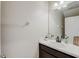 Clean bathroom with dark vanity and a modern sink at 828 Scrub Oak Hammock Rd, Davenport, FL 33837