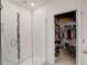 Modern bathroom with a walk-in shower and closet at 828 Scrub Oak Hammock Rd, Davenport, FL 33837