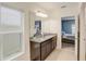 Double vanity bathroom with granite countertop and view of the bedroom at 828 Scrub Oak Hammock Rd, Davenport, FL 33837