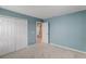 Bright bedroom with double doors leading to a large closet at 828 Scrub Oak Hammock Rd, Davenport, FL 33837