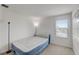 Simple bedroom with an air mattress, window, and neutral wall colors at 828 Scrub Oak Hammock Rd, Davenport, FL 33837