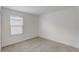 Spacious bedroom with a window and neutral wall colors at 828 Scrub Oak Hammock Rd, Davenport, FL 33837