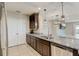 Kitchen with granite counters, dark wood cabinets, and stainless steel appliances at 828 Scrub Oak Hammock Rd, Davenport, FL 33837