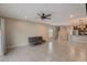 Open living room with tile floors, neutral walls, and a couch at 828 Scrub Oak Hammock Rd, Davenport, FL 33837