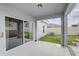 Sliding glass doors lead to a spacious covered patio at 828 Scrub Oak Hammock Rd, Davenport, FL 33837
