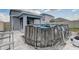 Grey wood-paneled above ground pool in backyard at 828 Scrub Oak Hammock Rd, Davenport, FL 33837