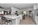 Modern kitchen with island, stainless steel appliances, and white cabinets at 9127 Sw 57Th Ter, Ocala, FL 34476