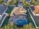 House with pool and screened enclosure, seen from above at 941 Orchard Charm Ct, Oviedo, FL 32765