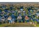 Aerial view showing a single Gathering home with pool and surrounding community at 941 Orchard Charm Ct, Oviedo, FL 32765