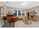 Bar area with piano, sofa, and wood cabinet at 941 Orchard Charm Ct, Oviedo, FL 32765