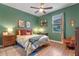 Cozy bedroom with a queen-size bed and wood floors at 941 Orchard Charm Ct, Oviedo, FL 32765