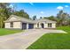 Newly constructed home with a three-car garage and spacious yard at Tbd Marion Oaks Ln, Ocala, FL 34473