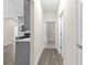 Bright hallway with gray cabinets and wood-look floors at Tbd Marion Oaks Ln, Ocala, FL 34473