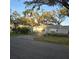 Fenced-in backyard with a basketball hoop and shed, perfect for outdoor activities and storage at 1026 Lake Jessamine Dr, Orlando, FL 32839