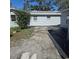 The backyard has partial stone walkways and maintained greenery at 1026 Lake Jessamine Dr, Orlando, FL 32839
