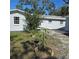 A beautiful backyard shot that features green shrubs and well-kept greenery at 1026 Lake Jessamine Dr, Orlando, FL 32839