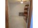 Clean basement featuring terrazzo flooring, ceiling fan and versatile space for storage or recreation at 1026 Lake Jessamine Dr, Orlando, FL 32839