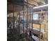 Basement view featuring a security door and abundant storage shelving at 1026 Lake Jessamine Dr, Orlando, FL 32839