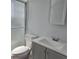 Well-lit bathroom featuring modern vanity, toilet, and glass-enclosed shower at 1026 Lake Jessamine Dr, Orlando, FL 32839