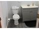 Bathroom featuring a modern vanity, toilet, and gray tile floors at 1026 Lake Jessamine Dr, Orlando, FL 32839