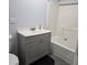 Bathroom with a white vanity, toilet, and shower with gray tile floors at 1026 Lake Jessamine Dr, Orlando, FL 32839
