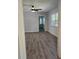 Bedroom with natural light, ceiling fan, and wood-look flooring at 1026 Lake Jessamine Dr, Orlando, FL 32839