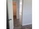 Open doorway to bedroom with hard wood floors and closet at 1026 Lake Jessamine Dr, Orlando, FL 32839