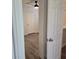 Bedroom with hard wood floors and white door at 1026 Lake Jessamine Dr, Orlando, FL 32839