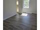 Bedroom featuring wood-look floors, neutral paint and natural light at 1026 Lake Jessamine Dr, Orlando, FL 32839