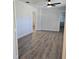 Spacious bedroom featuring a ceiling fan, and wood-look flooring at 1026 Lake Jessamine Dr, Orlando, FL 32839