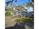 Charming single-story home with fenced yard, mature trees, and cozy curb appeal on a sunny day at 1026 Lake Jessamine Dr, Orlando, FL 32839