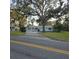 Charming single-story home with a well-manicured lawn and mature trees providing ample shade at 1026 Lake Jessamine Dr, Orlando, FL 32839