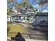 Charming single story home with mature trees, basketball hoop, and driveway with parking at 1026 Lake Jessamine Dr, Orlando, FL 32839