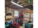 Organized garage space with storage and a convenient lawnmower at 1026 Lake Jessamine Dr, Orlando, FL 32839