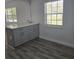 Kitchen island with cabinets and view to windows at 1026 Lake Jessamine Dr, Orlando, FL 32839
