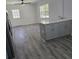 Kitchen island with cabinets and adjacent sitting room at 1026 Lake Jessamine Dr, Orlando, FL 32839