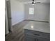 Kitchen island with cabinets and an adjacent exit door at 1026 Lake Jessamine Dr, Orlando, FL 32839