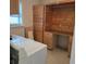 Laundry area with custom wood cabinets and counter space at 1026 Lake Jessamine Dr, Orlando, FL 32839