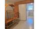 Basement laundry room with terrazzo floors, convenient access, and bright natural light from a window at 1026 Lake Jessamine Dr, Orlando, FL 32839