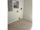 Room with tile flooring, a small window, and utility connections at 1026 Lake Jessamine Dr, Orlando, FL 32839