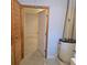 Well-lit utility room featuring a new water heater and easy-to-clean epoxy terrazzo flooring at 1026 Lake Jessamine Dr, Orlando, FL 32839