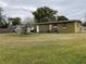 Large backyard with a shed and plenty of green space at 110 Country Club Cir, Sanford, FL 32771