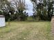 Large backyard with a shed and plenty of green space at 110 Country Club Cir, Sanford, FL 32771