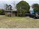 Ranch style home with a large front yard and mature trees at 110 Country Club Cir, Sanford, FL 32771