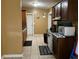 Kitchen with wood cabinets, tile floor and a full suite of appliances at 110 Country Club Cir, Sanford, FL 32771
