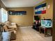 Bright living room featuring a comfortable sofa and large wall art at 110 Country Club Cir, Sanford, FL 32771