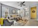 Living room with gray walls, tiled floors, and a ceiling fan at 1196 E 10Th St, Apopka, FL 32703