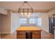 Well-lit living space featuring a dining island and modern light fixture at 124 Pinecrest Dr, Sanford, FL 32773